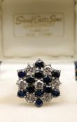 18CT GOLD SAPPHIRE & DIAMOND CLUSTER RING, of hexagonal shape, ring size I, 5.9gms