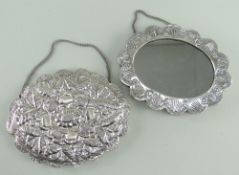 TWO TURKISH COIN SILVER WEDDING MIRRORS, stamped 900, repousse decorated in the Ottoman style, one