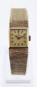 9CT GOLD OMEGA LADIES WRISTWATCH, the square dial having baton markers, with integrated textured 9ct