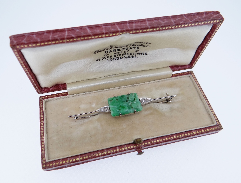 18CT WHITE GOLD JADEITE & DIAMOND BAR BROOCH, the central rectangular carved jadeite tablet