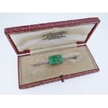 18CT WHITE GOLD JADEITE & DIAMOND BAR BROOCH, the central rectangular carved jadeite tablet