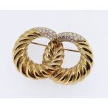 YELLOW METAL DIAMOND SET BAR BROOCH of double loop twist design, 4.4cms wide, 19.3gms, in vintage