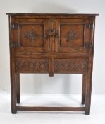 17TH CENTURY-STYLE OAK CUPBOARD, narrow rectangular top above pair of lozenge carved doors, and