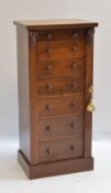19TH CENTURY WALNUT WELLINGTON CHEST OF SMALL PROPORTIONS, fitted graduated set of drawers between