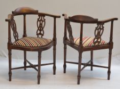 PAIR OF EARLY 20TH CENTURY GEORGIAN-STYLE CORNER CHAIRS with pierced splats and striked stuff-over