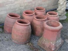 SIX TERRACOTTA GARDEN CLOCHES, 28cms high and a chimney pot (7) Provenance: deceased estate Neath/