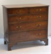 GEORGIAN-STYLE FIGURED MAHOGANY FIVE DRAWER CHEST, the moulded top above graduated cock beaded