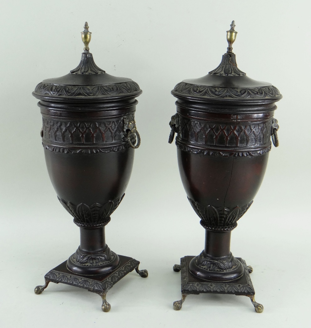 PAIR GEORGIAN-STYLE TURNED WOOD URNS & COVERS, foliate carved borders, brass urn finials, lion's