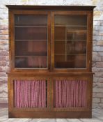 19TH CENTURY MAHOGANY BOOKCASE with shaped cornice, reel moulded glazed doors enclosing adjustable