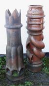 TWO GLAZED STONEWARE TALL CHIMNEY POTS, one a 'spiralvent', 121cms high, two other a crown top