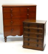 TWO CHESTS OF DRAWERS, one a late Victorian stained pine five drawer chest, 114.5h x 105w x 47cms,