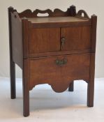 EARLY 19TH CENTURY MAHOGANY TRAY-TOP COMMODE, pierced handles above cupboard and pull-out section,