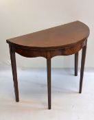 19TH CENTURY MAHOGANY D-SHAPED TEA TABLE, lined inlaid moulded edge above shaped frieze, tapering