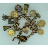 9CT GOLD CHARM BRACELET WITH 15CT GOLD PADLOCK CLASP & 13 CHARMS including a folded up one pound