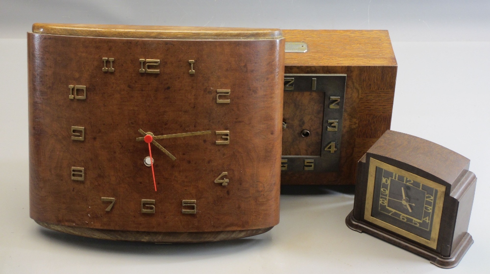 ART DECO CLOCKS - an excellent crossbanded mantel clock on bracket feet, bearing plaque 'Presented