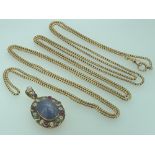 ELIZABETHAN STYLE LOCKET and a 9ct gold muff chain, the locket reportedly fashioned by Liberty,