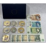 BRITISH BANK NOTE COMMEMORATIVE COINS with a quantity of banknotes, seven coins with denominations