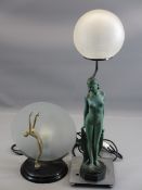 ART DECO LAMPS (2) - a composition nude lady on a chrome base with a circular glass shade, 57cms