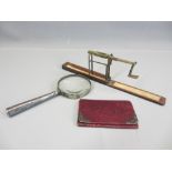A WILKINSON ORMSKIRK FOLDING GUINEA BALANCE in mahogany box, silver handled magnifying glass and a