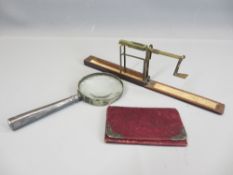 A WILKINSON ORMSKIRK FOLDING GUINEA BALANCE in mahogany box, silver handled magnifying glass and a