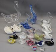 SWAN ORNAMENTS IN POTTERY & GLASSWARE, some being iridescent colourful glass