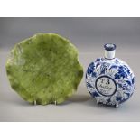 CARVED ONYX TYPE STONEWARE DISH and a delftware circular flask inscribed to the front 'T B Audley