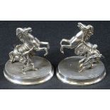 SILVERED MARLEY HORSES WITH ATTENDANTS, A PAIR - on oval bases, 22cms H, 18cms L
