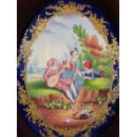 HAND PAINTED PORCELAIN PLAQUE depicting children with musical instruments, cobalt blue and gilt