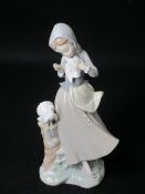 LLADRO - young standing girl with two doves, 24cms H