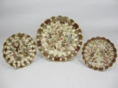 SATSUMA PLATE, 23cms diameter and a similar pair of smaller, 14cms diameter