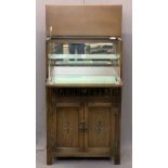 JAYCEE OAK COCKTAIL CABINET with carved and linenfold detail, lift top drop down front with mirrored
