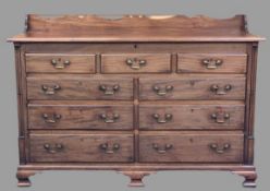 GEORGE III MAHOGANY LANCASHIRE MULE CHEST having a shaped railback to the top and lift-up lid to