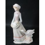 LLADRO - young standing girl with goose alongside and gosling in her arms, 30cms H