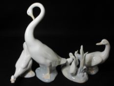 NAO - two Nao geese, a group of three on an oval base and a large single preening goose, 24cms H