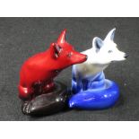 ROYAL DOULTON FLAMBE SEATED FOX and one other in white colourway, 10.5cm heights (the latter