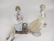 NAO FIGURINES (2) - Girl with a basket and a lady sat near a telephone, 24cms H the tallest