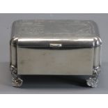 RUSSIAN SILVER OBLONG CIGARETTE BOX - on four corner shell type supports, the lid having geometric