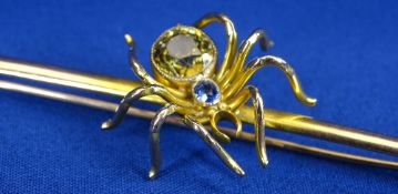 9CT GOLD BAR BROOCH - 7.5cms L, featuring a large spider with large circular citrine and small