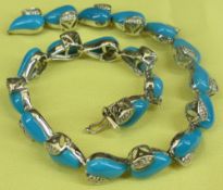 18CT WHITE GOLD DIAMOND SET TURQUOISE COLOURED HEART LINK BRACELET of twenty dyed howlites and