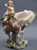 ROYAL DUX - stamped 1066, an Art Nouveau centrepiece, maidens seated upon a conch shell, 37cms tall,