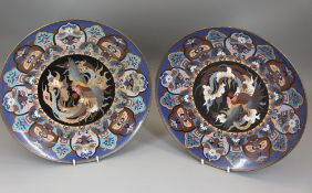 CLOISONNE PLATES, a pair, with exotic bird decoration, 30cms diameter