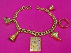 9CT GOLD CURB LINK CHARM BRACELET WITH 6 CHARMS - 19cms overall L, 39grms gross, the charms