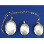 925 OVAL BRIGHT CUT LOCKET & CHAIN, 15.6grms, a further similar size and a large example, 34.6grms