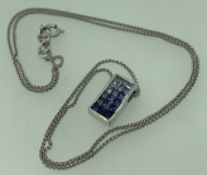 18CT WHITE GOLD GRADUATED SATURATION TANZANITE PENDANT WITH CHAIN, the tanzanites graded in colour