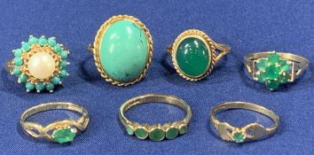 9CT GOLD DRESS RINGS (7) - various green stones, 21grms