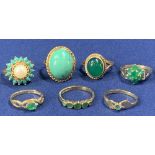 9CT GOLD DRESS RINGS (7) - various green stones, 21grms
