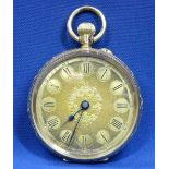 LADY'S 14CT GOLD FOB WATCH - finely decorated with gold dial, floral centre and Roman numerals,