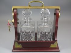 TANTALUS, reproduction, two bottle with a pair of hobnail cut, square based decanters, locking key