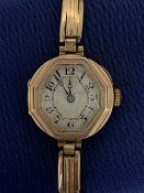 VINTAGE 9CT GOLD LADY'S BRACELET WRISTWATCH - the dial set with Arabic numerals, 18grms gross