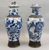 LARGE CRACKLE GLAZED BLUE & WHITE DRAGON VASES, A PAIR with covers having dog of Fo knops (missing